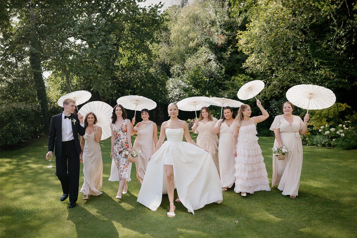 Bride and bridesmaids with parasols